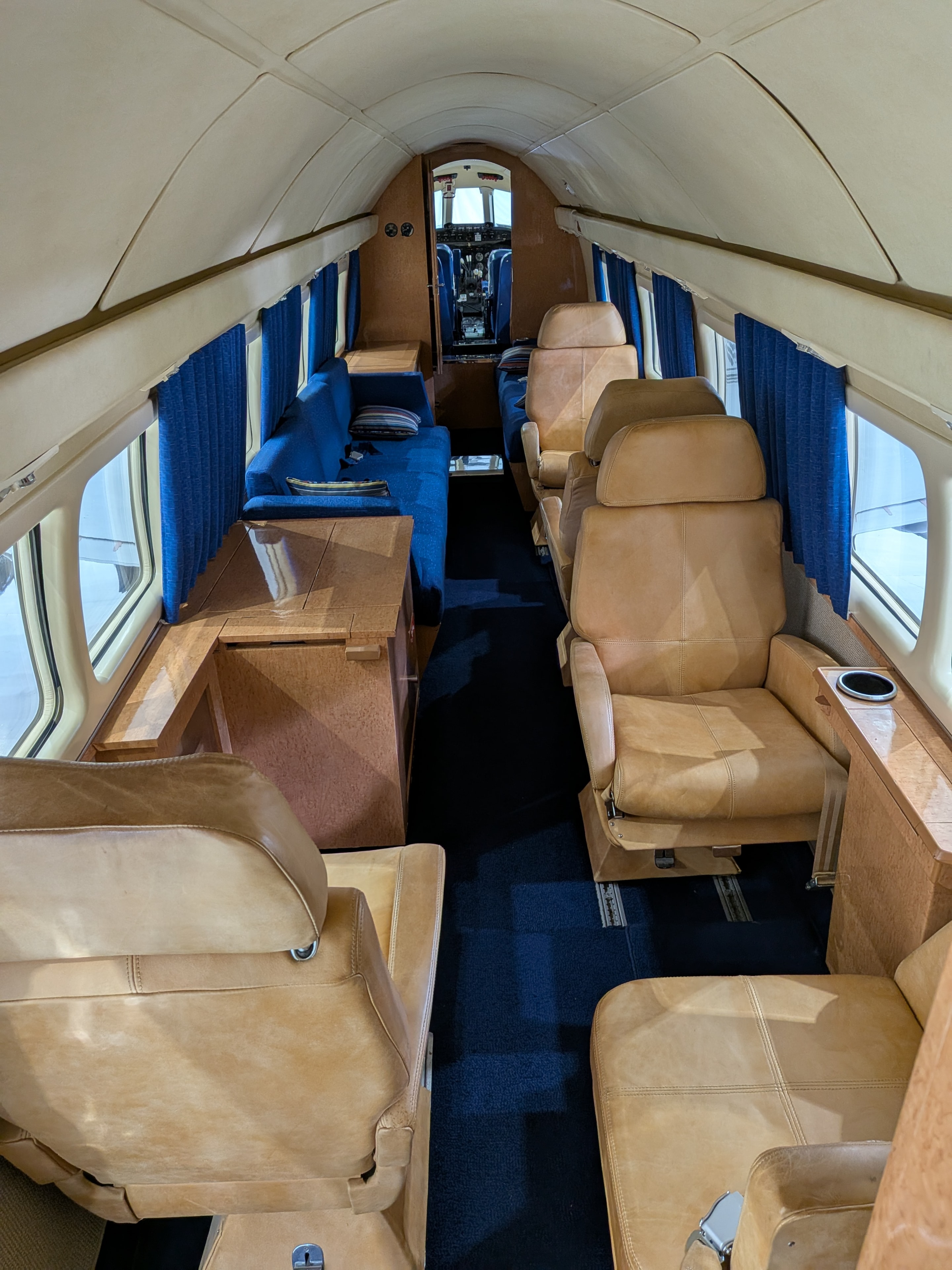 Howard 500 cabin looking aft — tan leather executive seating